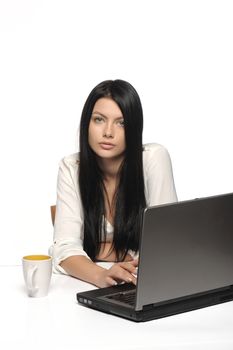 Stressful business woman working on laptop 