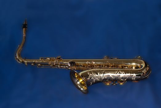 Saxophone on blue background