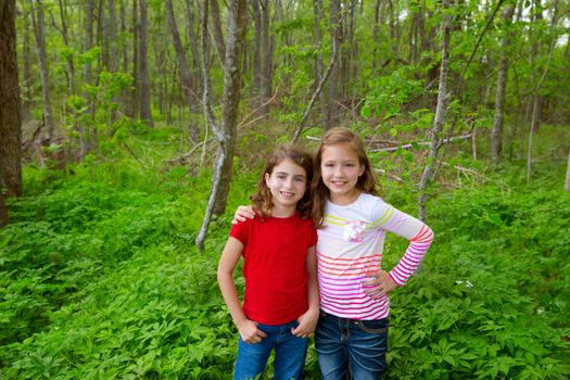 children sister friends playing relaxed on the jungle park forest outdoor