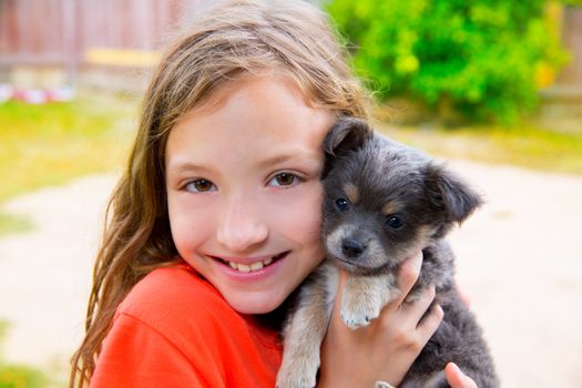Beautiful kid girl portrait with puppy chihuahua gray dog