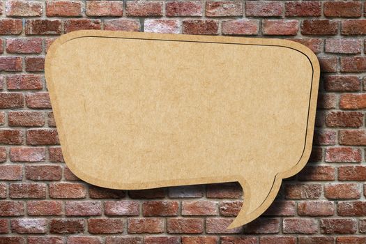 Recycle paper speech bubble on old brick wall background