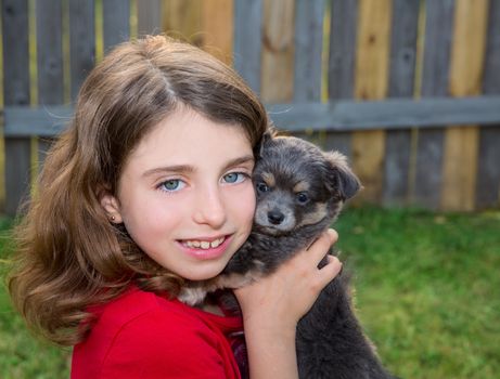 Beautiful kid girl portrait with puppy chihuahua gray dog