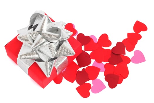 Valentines Day gift in red box and small hearts isolated on white