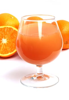 Orane juice and oranges on white background