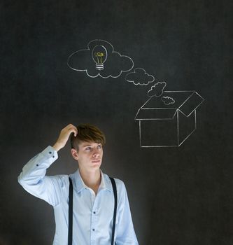 Businessman, student or teacher thinking out the box chalk concept blackboard background