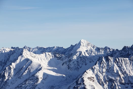 Winter alpine mountains covered with snow