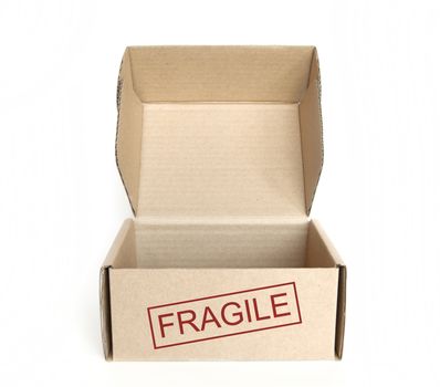 empty logistics cardboard box with fragile text on white background