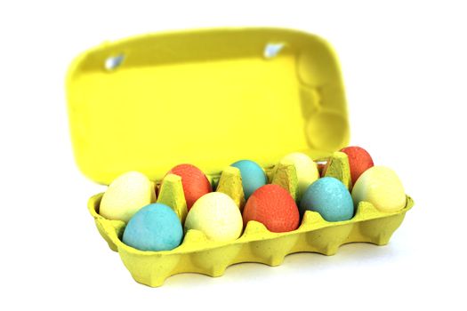 Colorful easter eggs in yellow box on white background