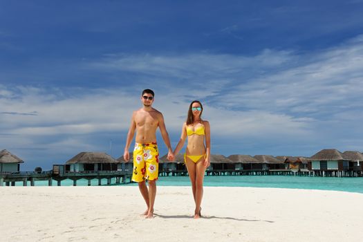 Couple on a tropical beach at Maldives