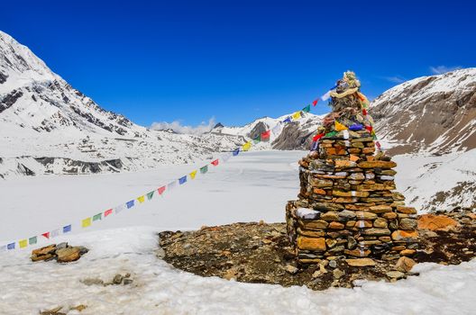 Himalayas mountains frozen lake and stop with flags, Nepal