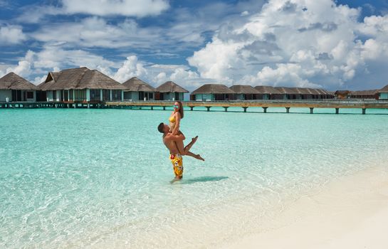 Couple on a tropical beach at Maldives