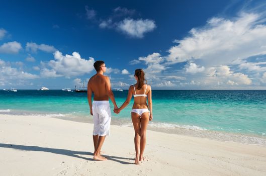 Couple on a tropical beach at Maldives