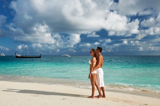 Couple on a tropical beach at Maldives