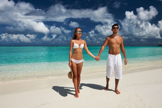 Couple on a tropical beach at Maldives