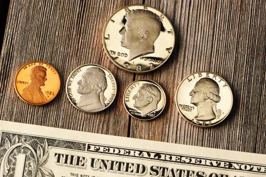 New uncirculated US money over wooden background