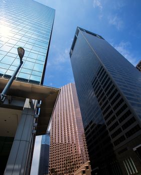 Houston downtown skyscrapers disctict with mirror blue sky reflection