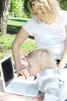 young mother and child with laptop