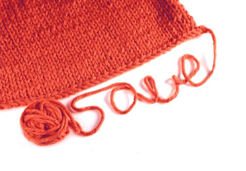 Winter sale concept red knitted background close up