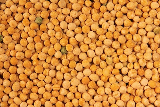 Yellow dry pea background close up