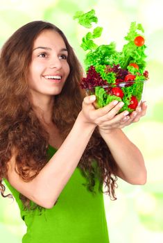 Woman with bowl of flying light salad diet concept