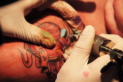 Making of colorful tattoo with heart rose and ribbon