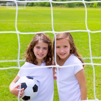 Soccer football kid girls playing on sports outdoor field