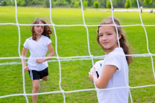 Soccer football kid girls playing on sports outdoor field