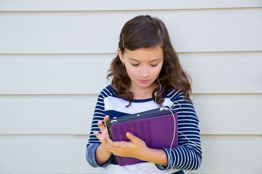 Teen girl happy holding tablet pc and earings smiling