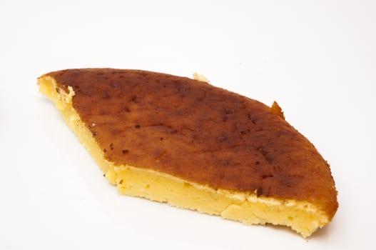 piece of cheese cake on a white background