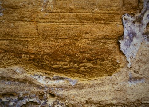 texture orange ocher fragment of the old wall with sandstone