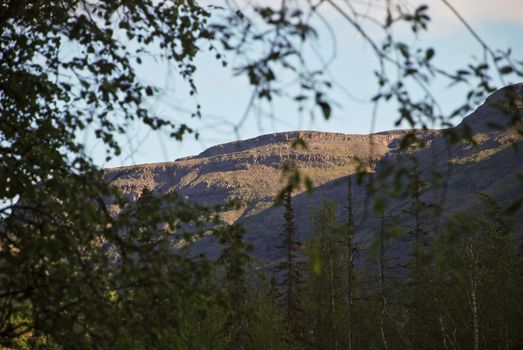 Mountains rise along the river, which is difficult to climb