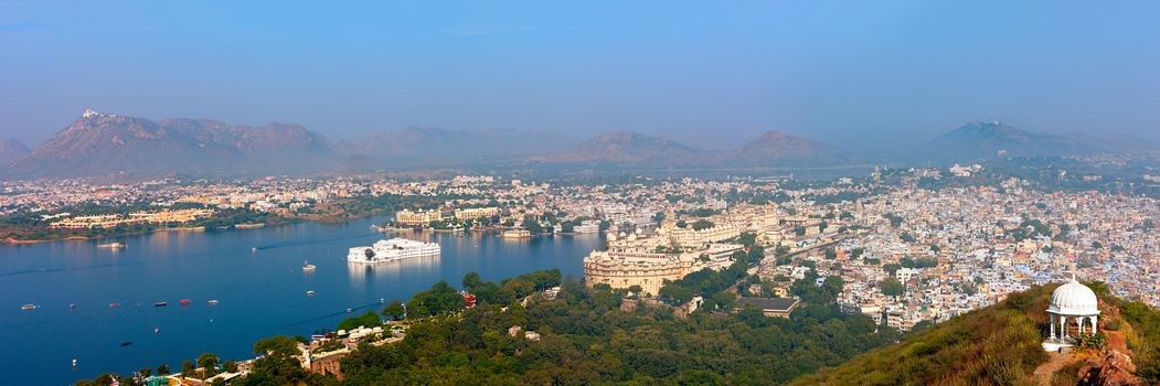 View of Udaipur from Machla Magra (Fish Hill). Lake Pichola, Udaipur hills, City Palace and the numerous attractions of the city. Udaipur, Rajasthan, India, Asia. Panorama.