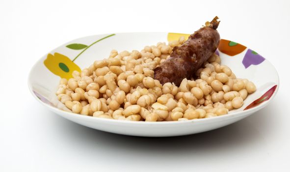 monchetas dish with sausage on a white background