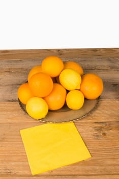 Still life with assorted citrus fruit on a wooden table