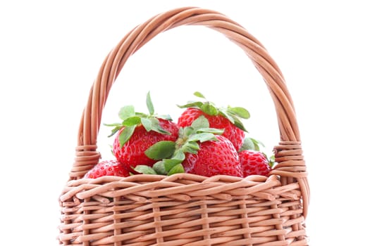 close up of basket with strawberries over white