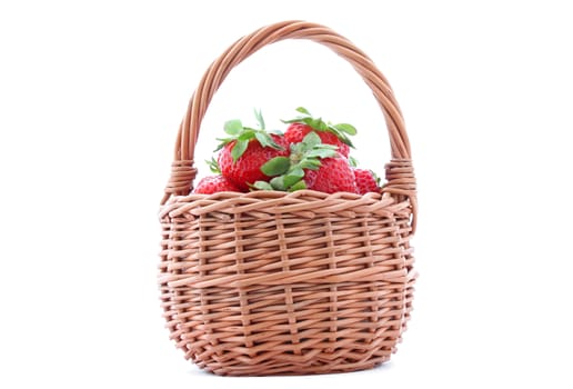 wicker basket with strawberries isolated on white