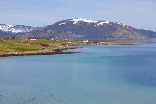 Snowcapped mountains and blue water, Norwegian fjord