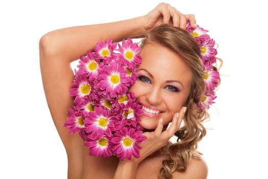 Beautiful young caucasian woman with flowers in her hair isolated over white background