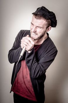 hipster stylish singer on gray background
