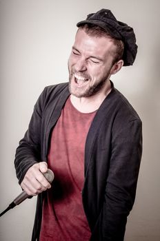 hipster stylish singer on gray background