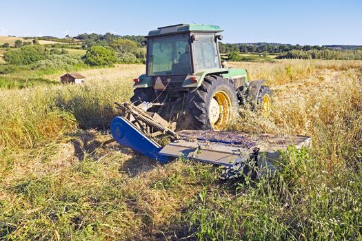 Tractor harvesting in the countryside