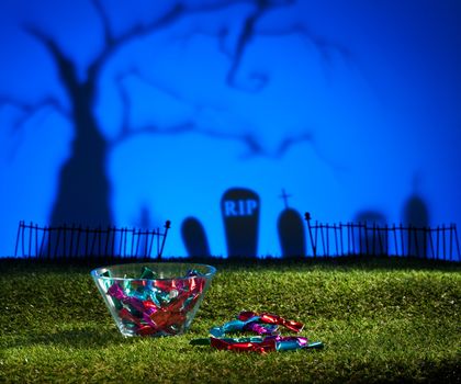 Halloween landscape with tree graveyard and sweets