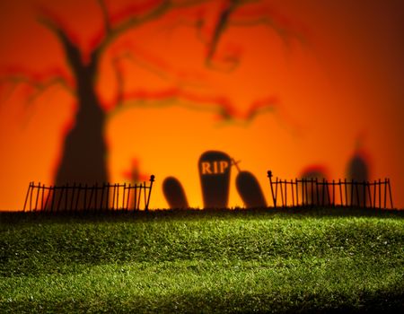 Halloween colorful landscape with tree and graveyard