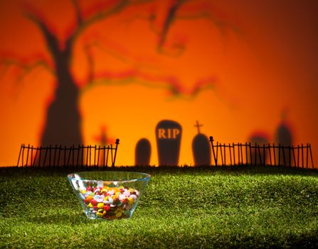 Halloween landscape with tree graveyard and sweets