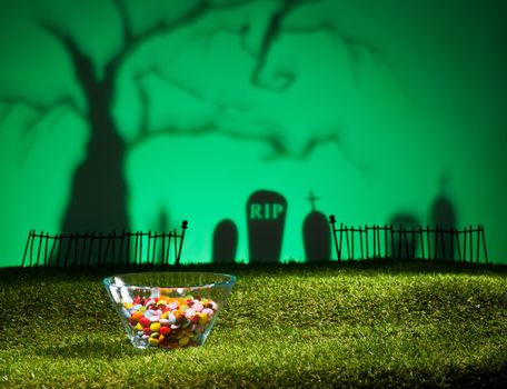 Halloween landscape with tree graveyard and sweets