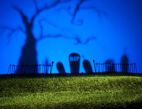 Halloween colorful landscape with tree and graveyard