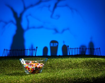 Halloween landscape with tree graveyard and sweets