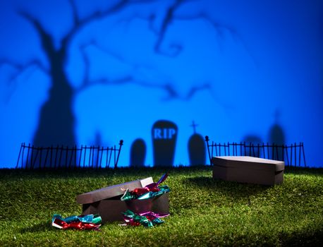 Halloween landscape with tree graveyard and sweets