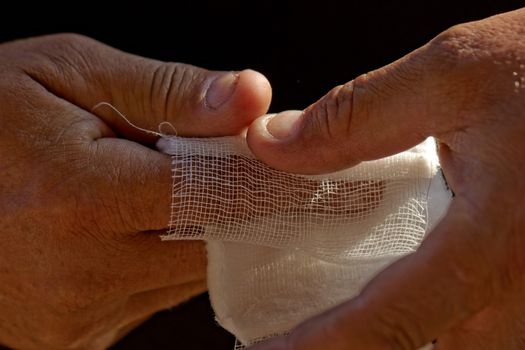 white medicine bandage on injury finger