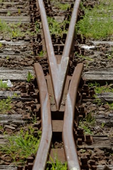 rusty railway track crossing